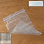 Transparent plastic zip lock bag measuring 33x23 cm for storage