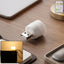 Yellow USB LED night light plugged into a USB port illuminating warm ambient glow